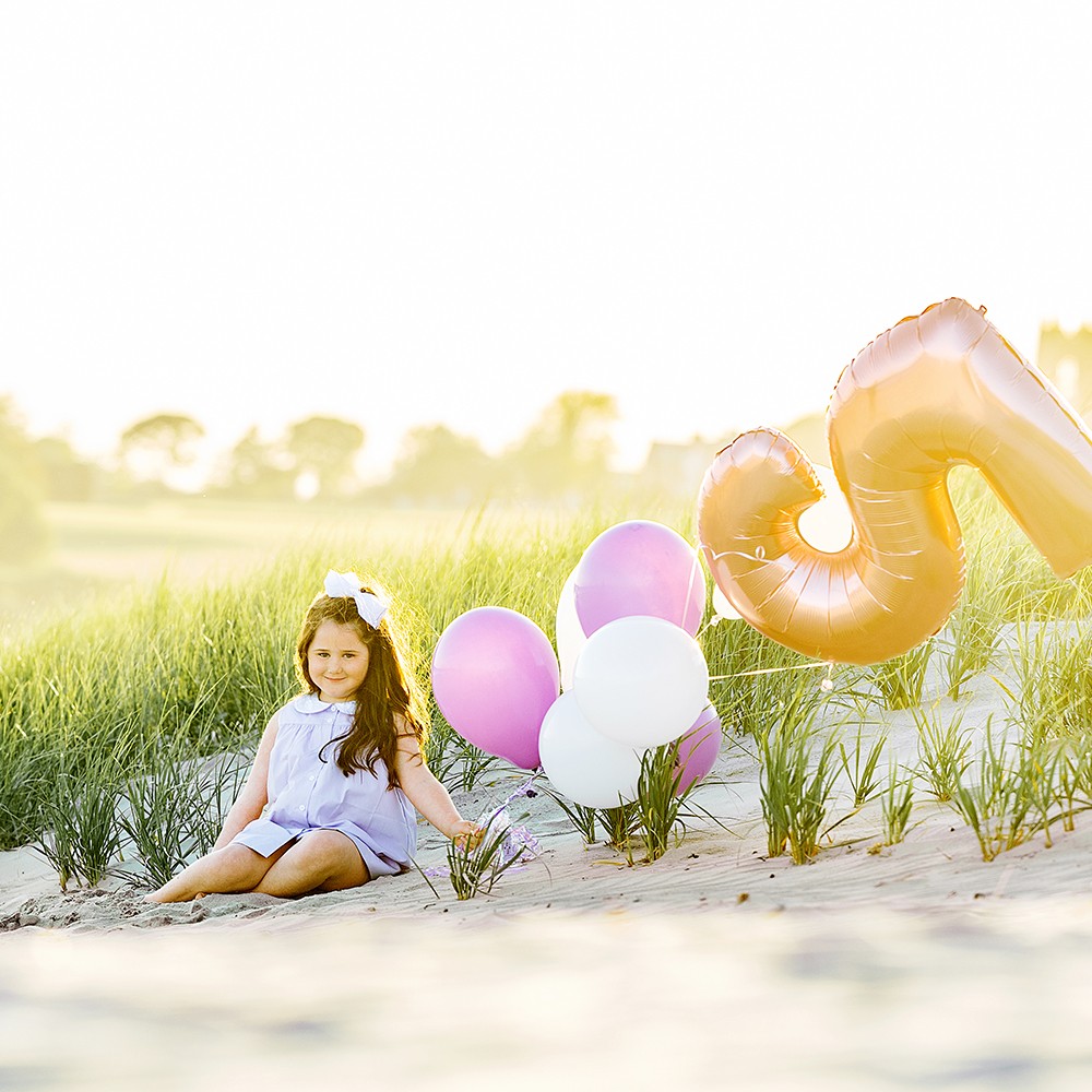 Birthday Girl Beach Photography | Second Beach, Sachuest Point, Sachuest Bach ● Middletown, RI, Newport, RI - girl sitting on sand with birthday balloons