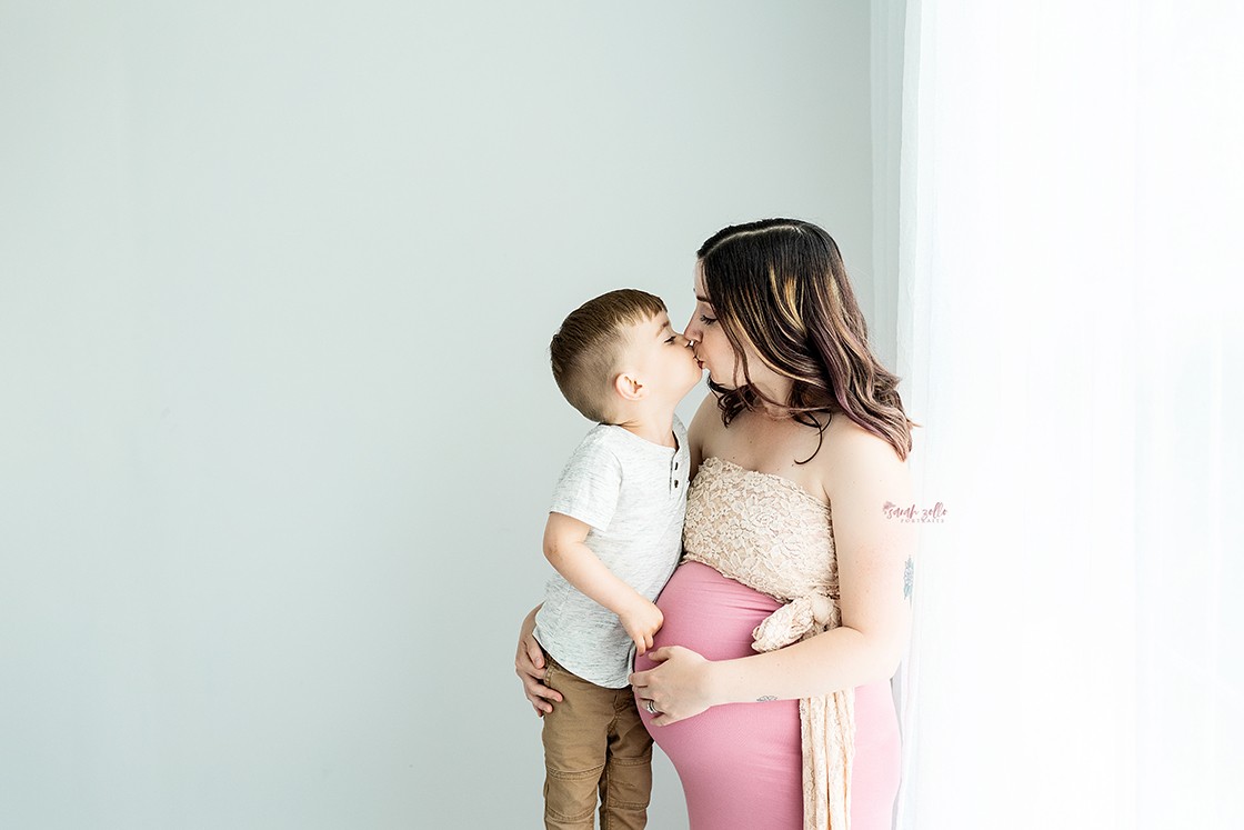 In Studio + Outdoor Maternity Photography and Photo Session Warwick, RI, Conimicut Village, Conimicut Point - mother to be and son kissing