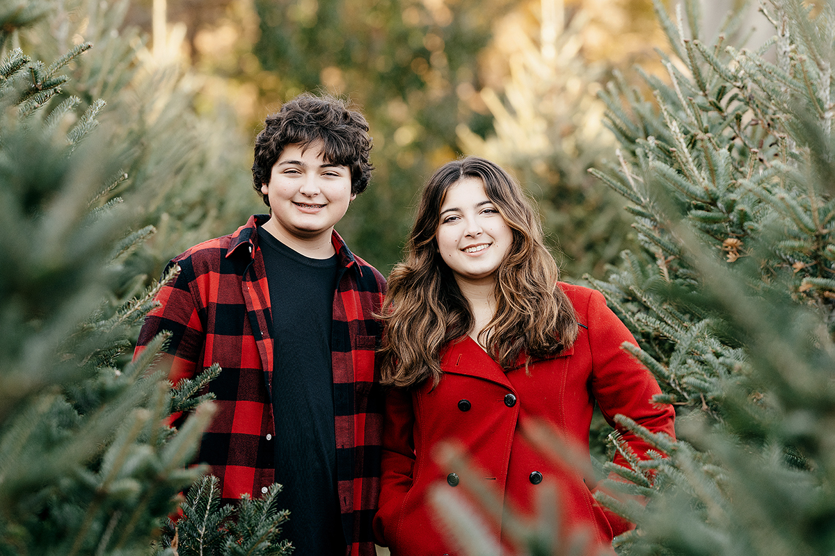 Family Photography and Photo mini Sessions at The Farmer's Daughter Tree Farm in South Kingstown, RI - brother and sister standing in trees