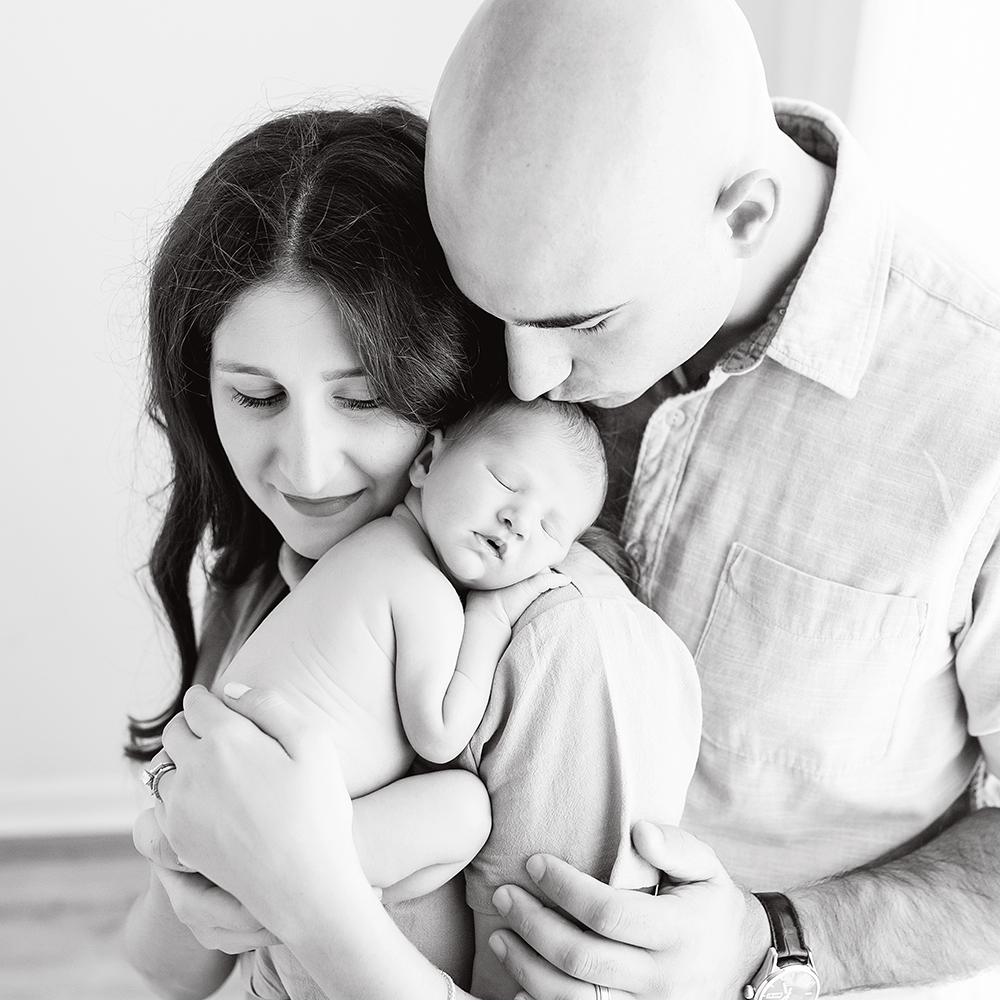 Newborn Photography, Studio Newborn and Baby Photo Session | Warwick, RI - new parents with baby, black and white