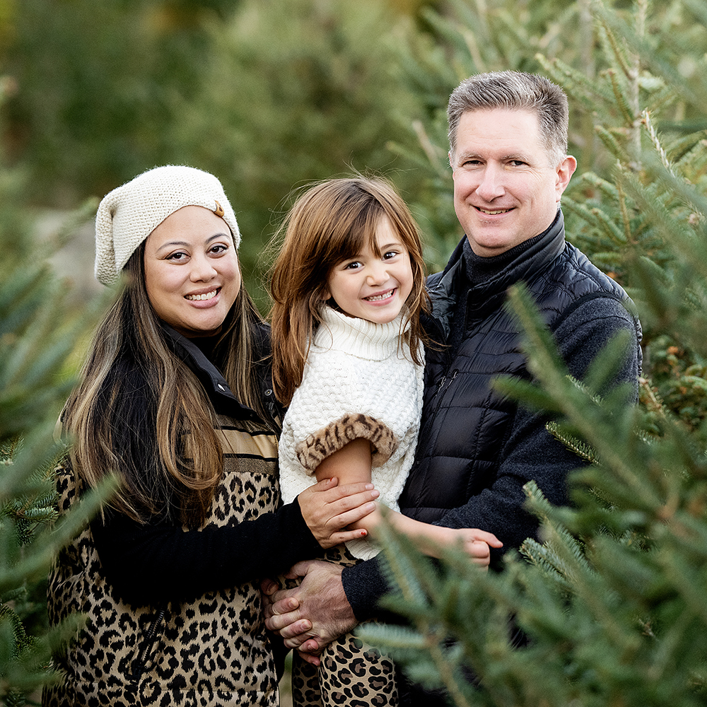 Family Photography and Photo mini Sessions at The Farmer's Daughter Tree Farm in South Kingstown, RI - family standing in trees