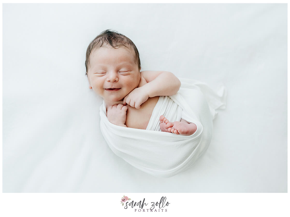 Hope Valley, RI Newborn Baby Photoshoot. Smiling newborn. 