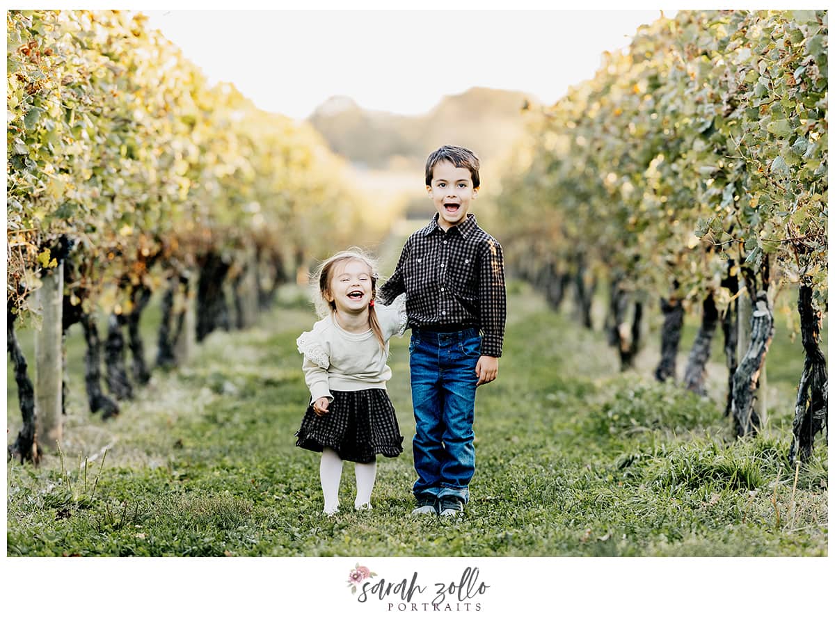 siblings laughing in vineyard - family photography newport vineyards ri - sara zollo portraits