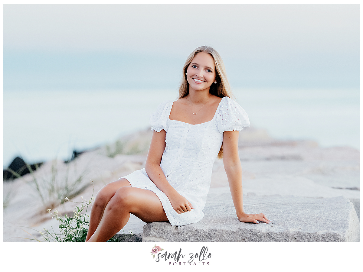high school senior portraits Rhode Island Connecticut girl in white dress on rock jetty