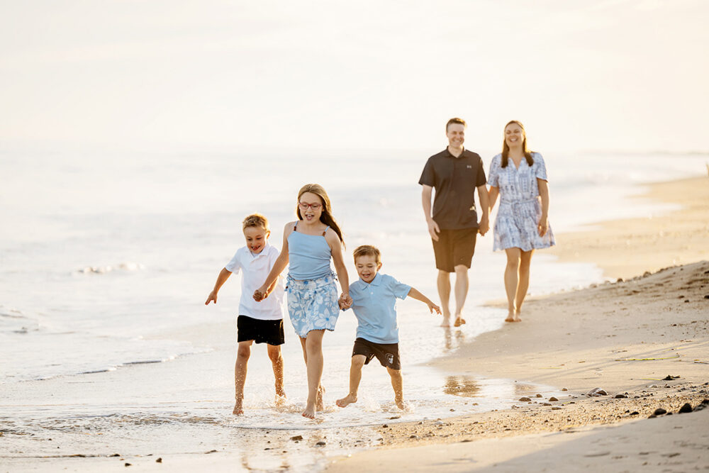 rhode-island-beach-family-photographer-kids-running-sunset