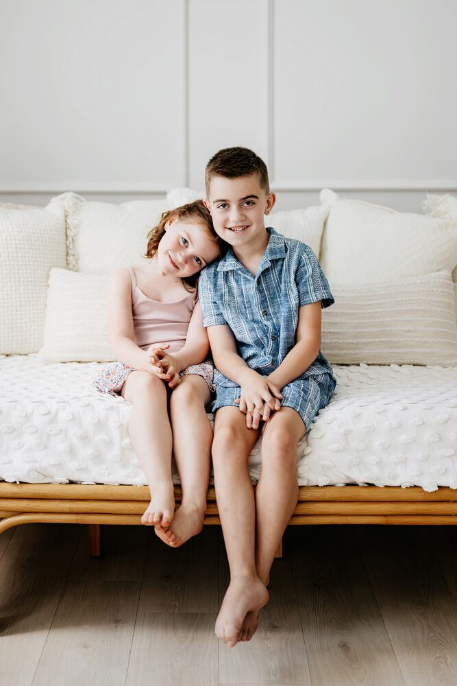 ri-family-photographer-studio-siblings-couch-portrait