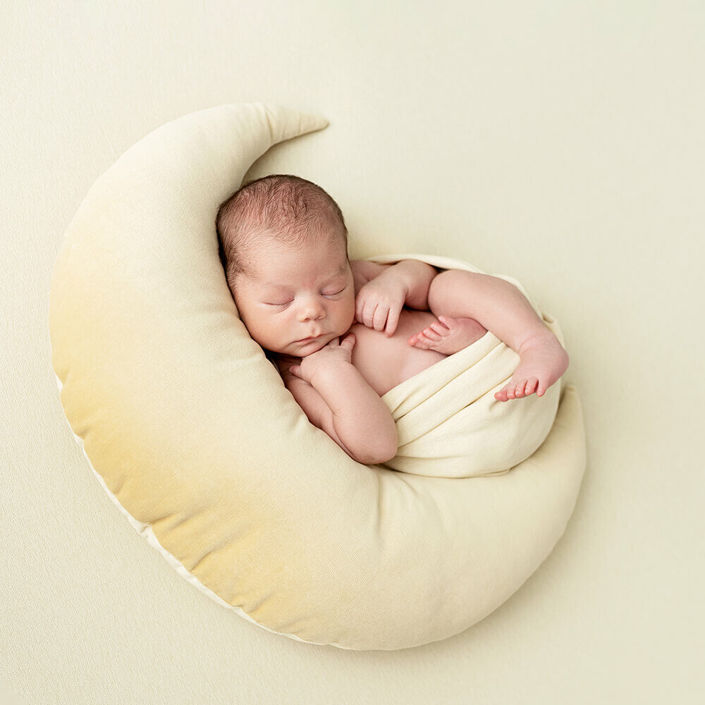 Newborn Photography Rhode Island - baby swaddled in moon pillow